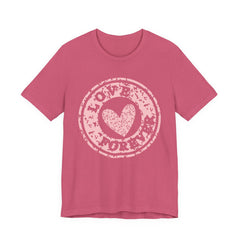 Heart Stamp Tee — Pink 'Love More' Graphic T-Shirt