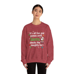Christmas Sweatshirt — "It's all fun and games until Santa checks the naughty list" Cozy Holiday Gildan Crewneck