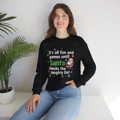 Christmas Sweatshirt — "It's all fun and games until Santa checks the naughty list" Cozy Holiday Gildan Crewneck