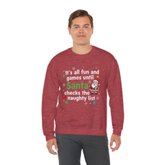 Christmas Sweatshirt — "It's all fun and games until Santa checks the naughty list" Cozy Holiday Gildan Crewneck