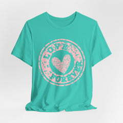 Heart Stamp Tee — Pink 'Love More' Graphic T-Shirt