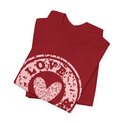 Heart Stamp Tee — Pink 'Love More' Graphic T-Shirt