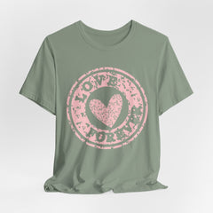 Heart Stamp Tee — Pink 'Love More' Graphic T-Shirt