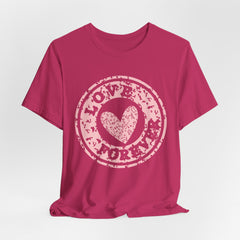 Heart Stamp Tee — Pink 'Love More' Graphic T-Shirt