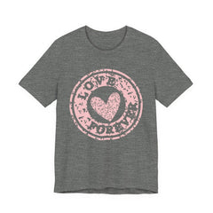 Heart Stamp Tee — Pink 'Love More' Graphic T-Shirt