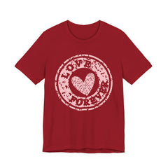 Heart Stamp Tee — Pink 'Love More' Graphic T-Shirt