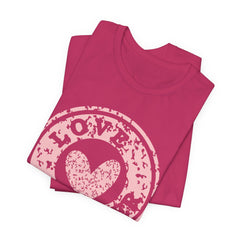 Heart Stamp Tee — Pink 'Love More' Graphic T-Shirt